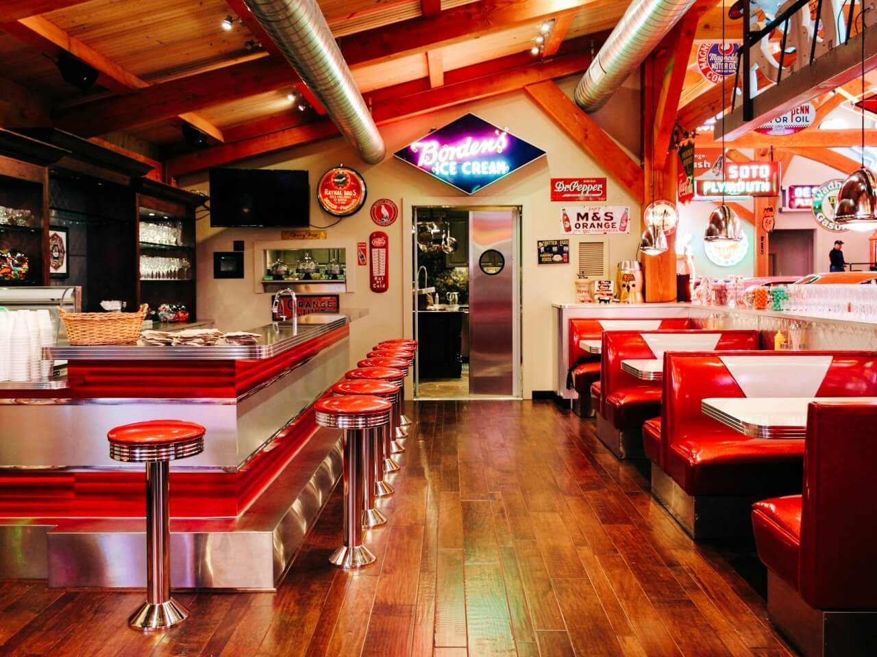 Classic diner interior with booth seating, counter stools, and retro decor